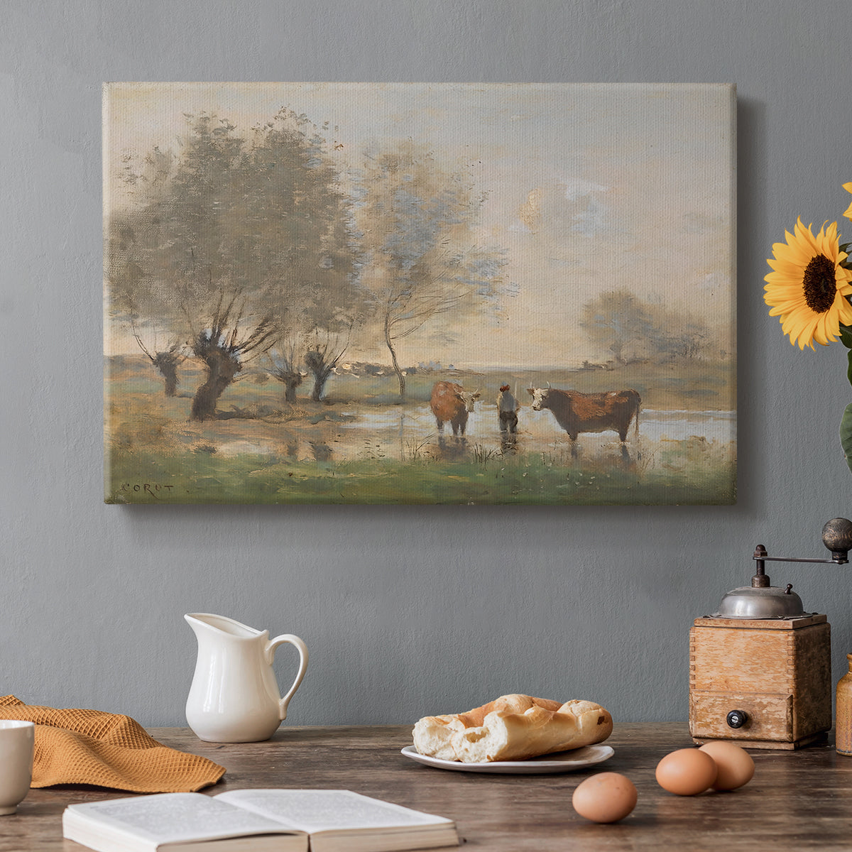 Canvas art print featuring a cows standing in wetland landscape with trees and water, set in a cozy kitchen setting