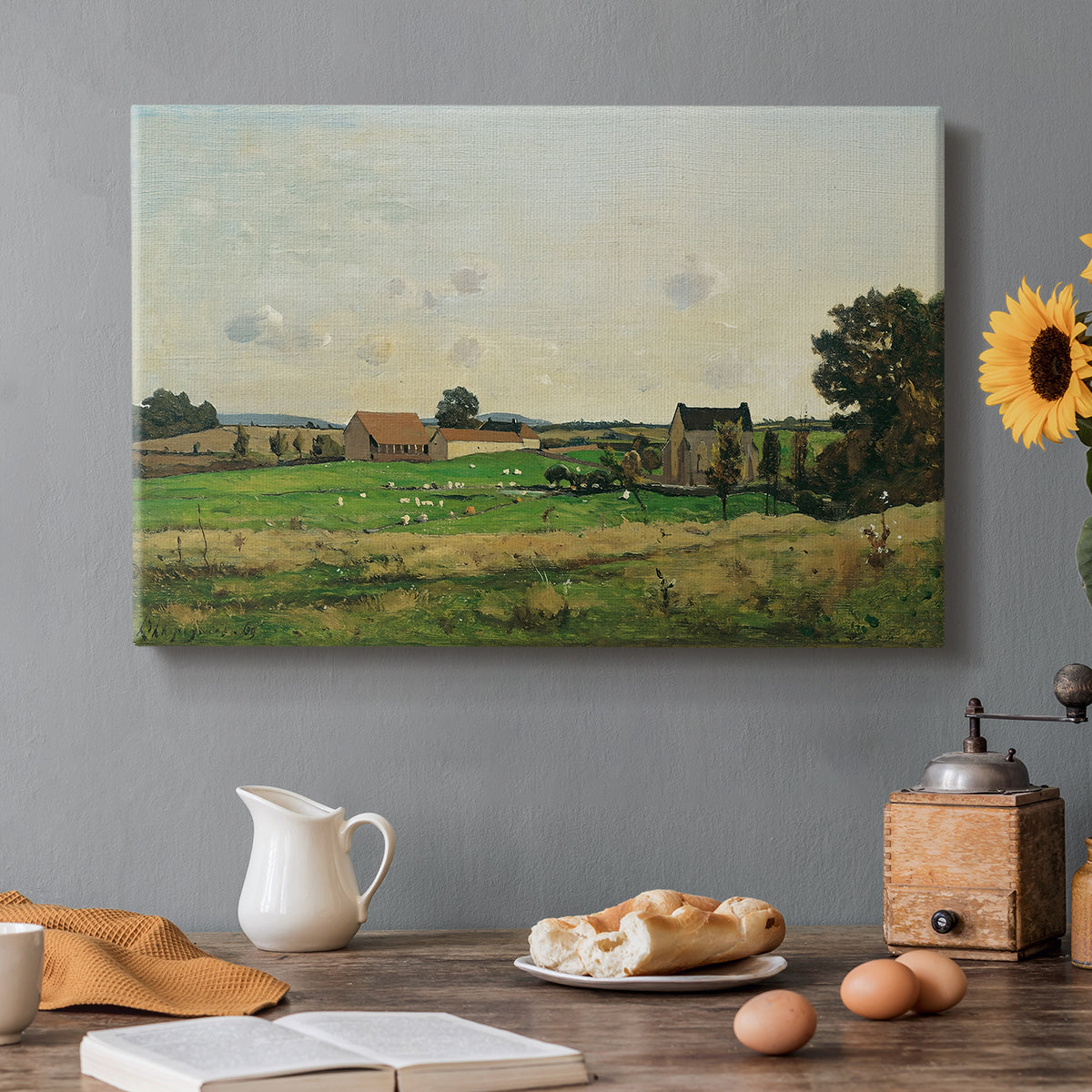 Canvas art print featuring an estate building surrounded by trees and open pastoral landscape, set in a cozy kitchen setting