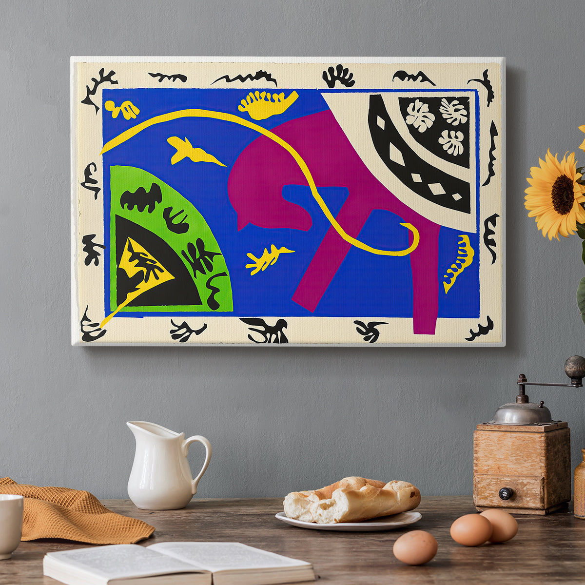 Canvas art print featuring abstract figures of a horse, rider, and clown in a bold cut-out composition, set in a cozy kitchen setting