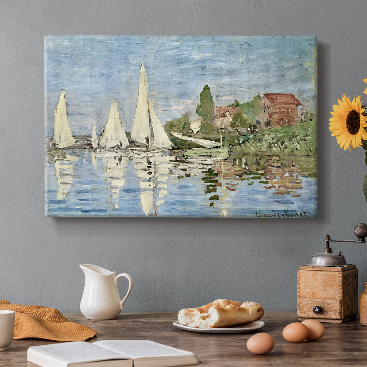 Canvas art print featuring colorful sailboats racing across river under bright sky, set in a cozy kitchen setting