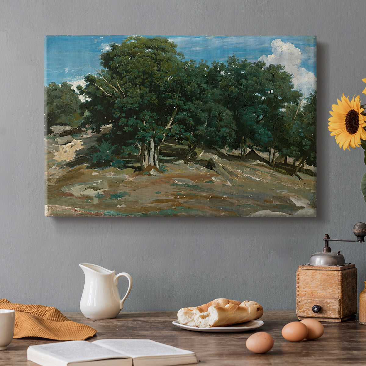 Canvas art print featuring large oak trees dominating forest landscape with open ground beneath, set in a cozy kitchen setting