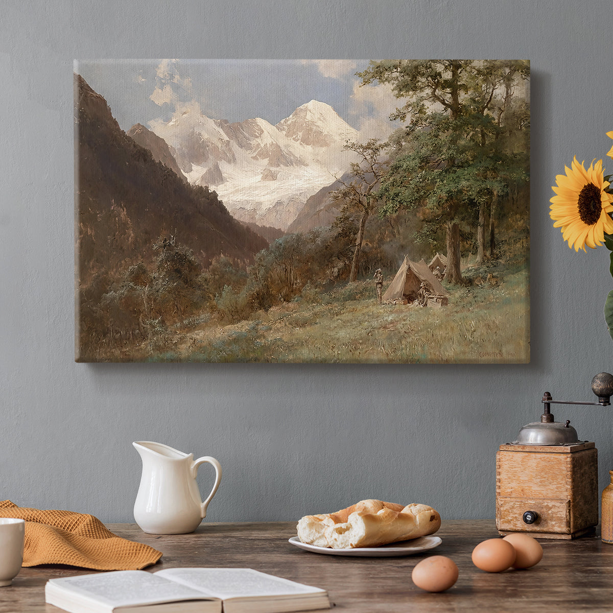 Canvas art print featuring a mountainous landscape with rugged terrain and distant peaks, set in a cozy kitchen setting