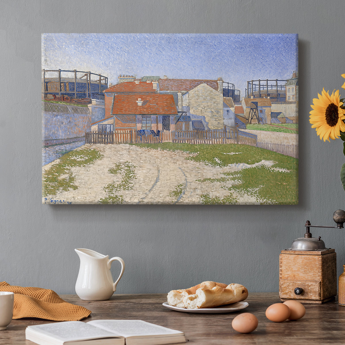 Canvas art print featuring industrial gas structures in urban landscape, set in a cozy kitchen setting