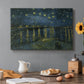Canvas art print featuring a night river scene with reflections of lights and stars across water, set in a cozy kitchen setting