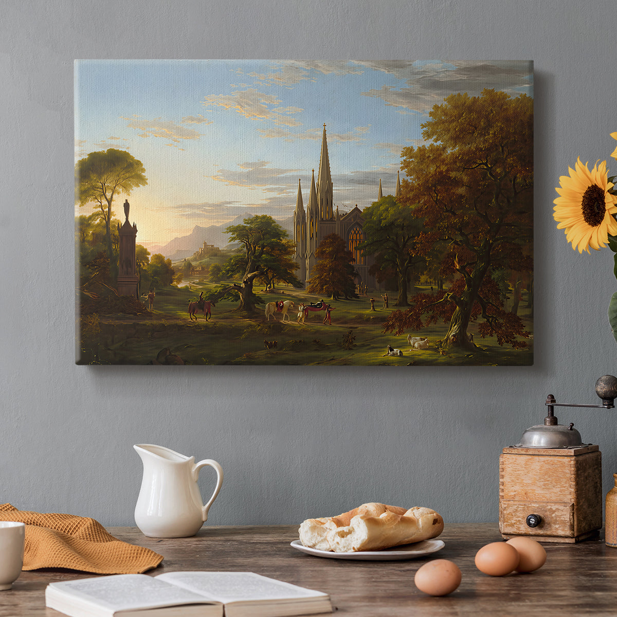 Canvas art print featuring figures approaching settlement within expansive landscape under warm light, set in a cozy kitchen setting