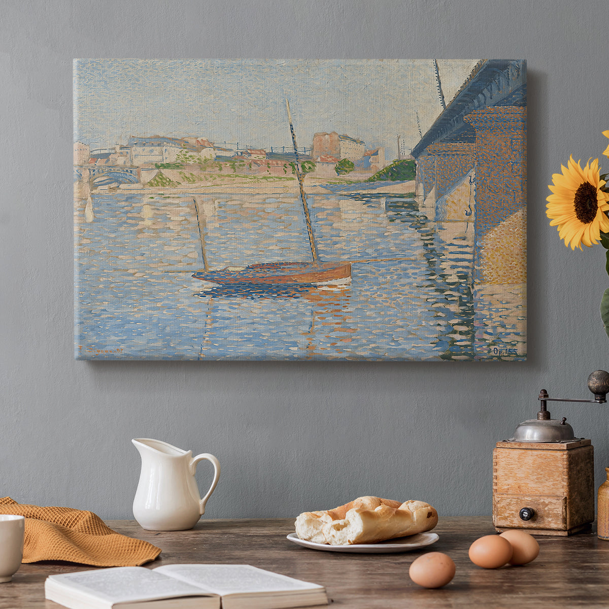 Canvas art print featuring boats docked along river with masts, set in a cozy kitchen setting