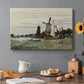 Canvas art print featuring a single windmill beside water with surrounding buildings and sky, set in a cozy kitchen setting