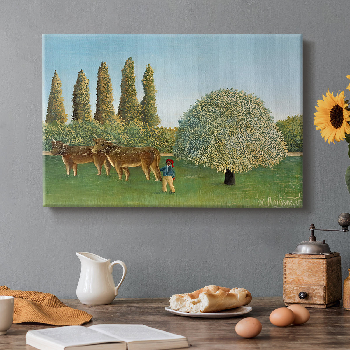 Canvas art print featuring grazing animals in open meadow with trees and simple landscape, set in a cozy kitchen setting