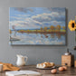Canvas art print featuring a riverside landscape with water trees and distant structures, set in a cozy kitchen setting