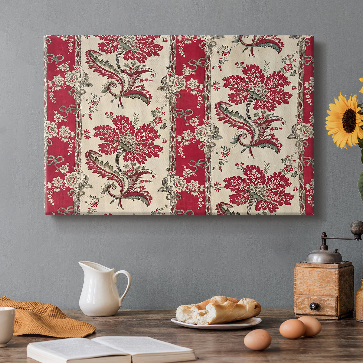 Canvas art print featuring a repeating pattern with floral arrangements emerging from horn-shaped forms, set in a cozy kitchen setting