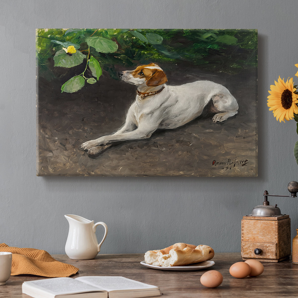 Canvas art print featuring a dog lying on ground with head raised in natural outdoor setting, set in a cozy kitchen setting