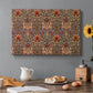 Canvas art print featuring a repeating pattern of stylized flowers with warm red tones and curved stems, set in a cozy kitchen setting