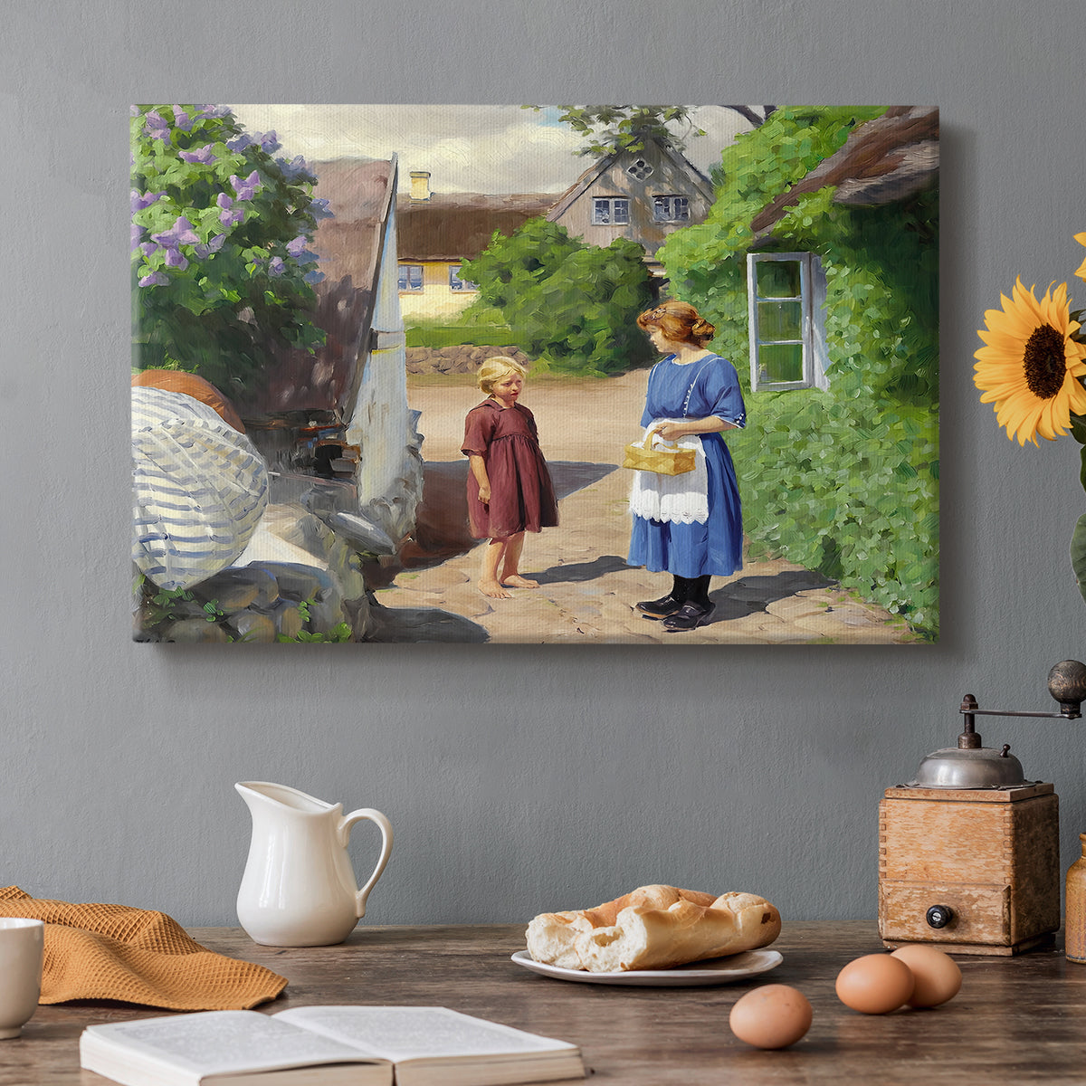 Canvas art print featuring people walking along village path beside houses in bright summer light, set in a cozy kitchen setting