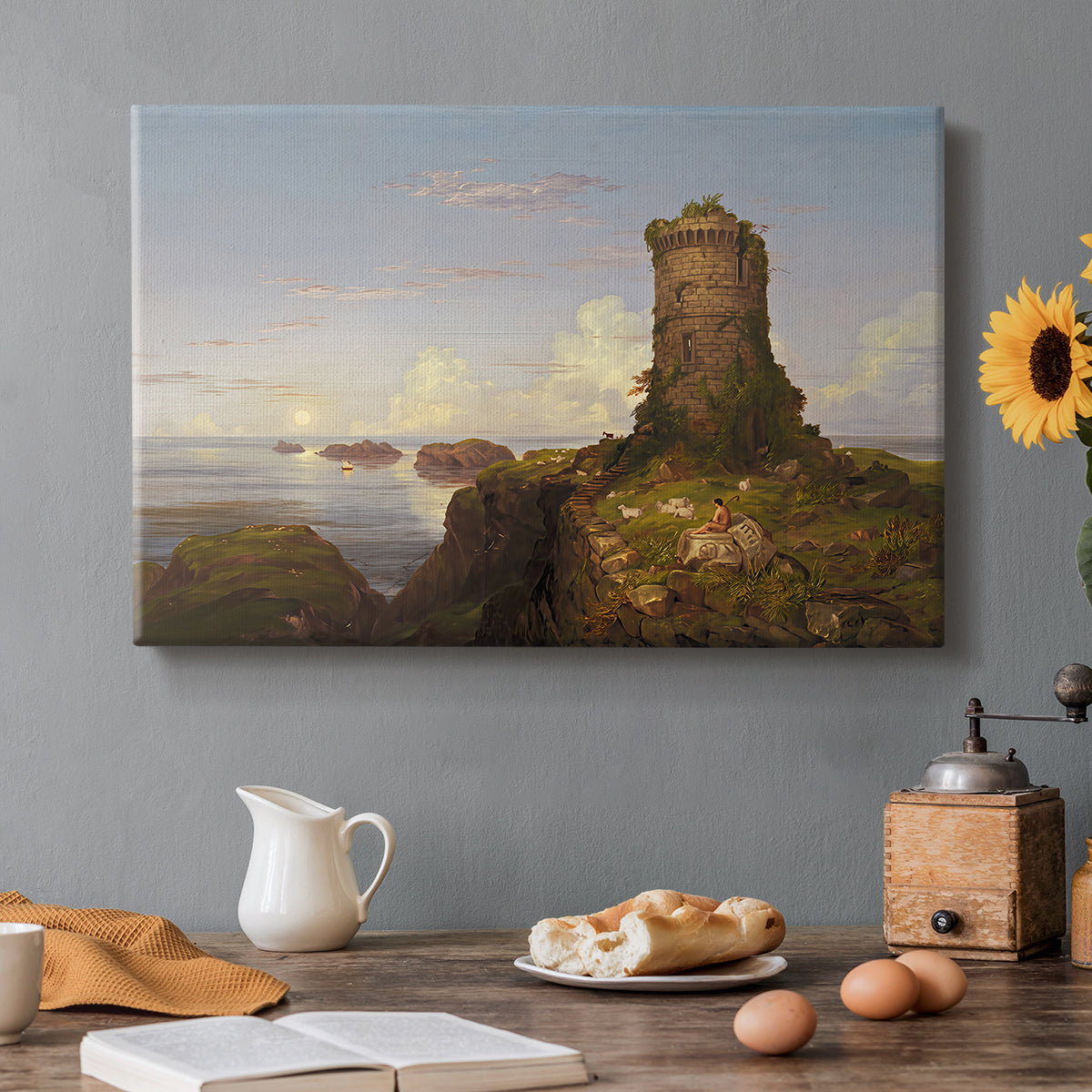 Canvas art print featuring a coastal landscape with ruined tower overlooking sea, set in a cozy kitchen setting