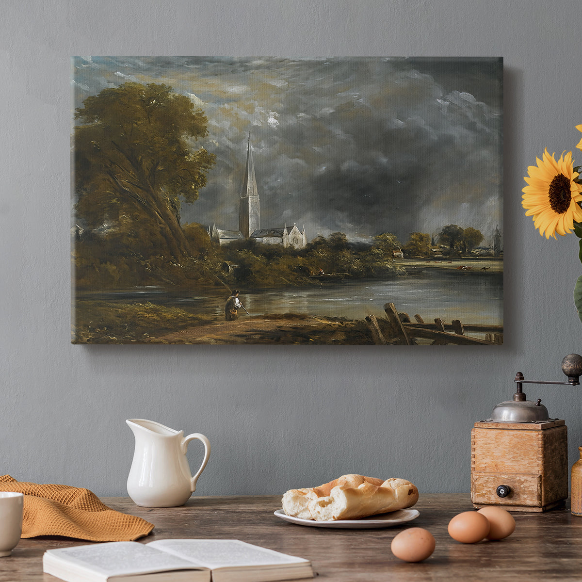 Canvas art print featuring a cathedral viewed across meadow with water, set in a cozy kitchen setting