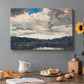 Canvas art print featuring a single boat floating on still lake surrounded by forested shoreline, set in a cozy kitchen setting
