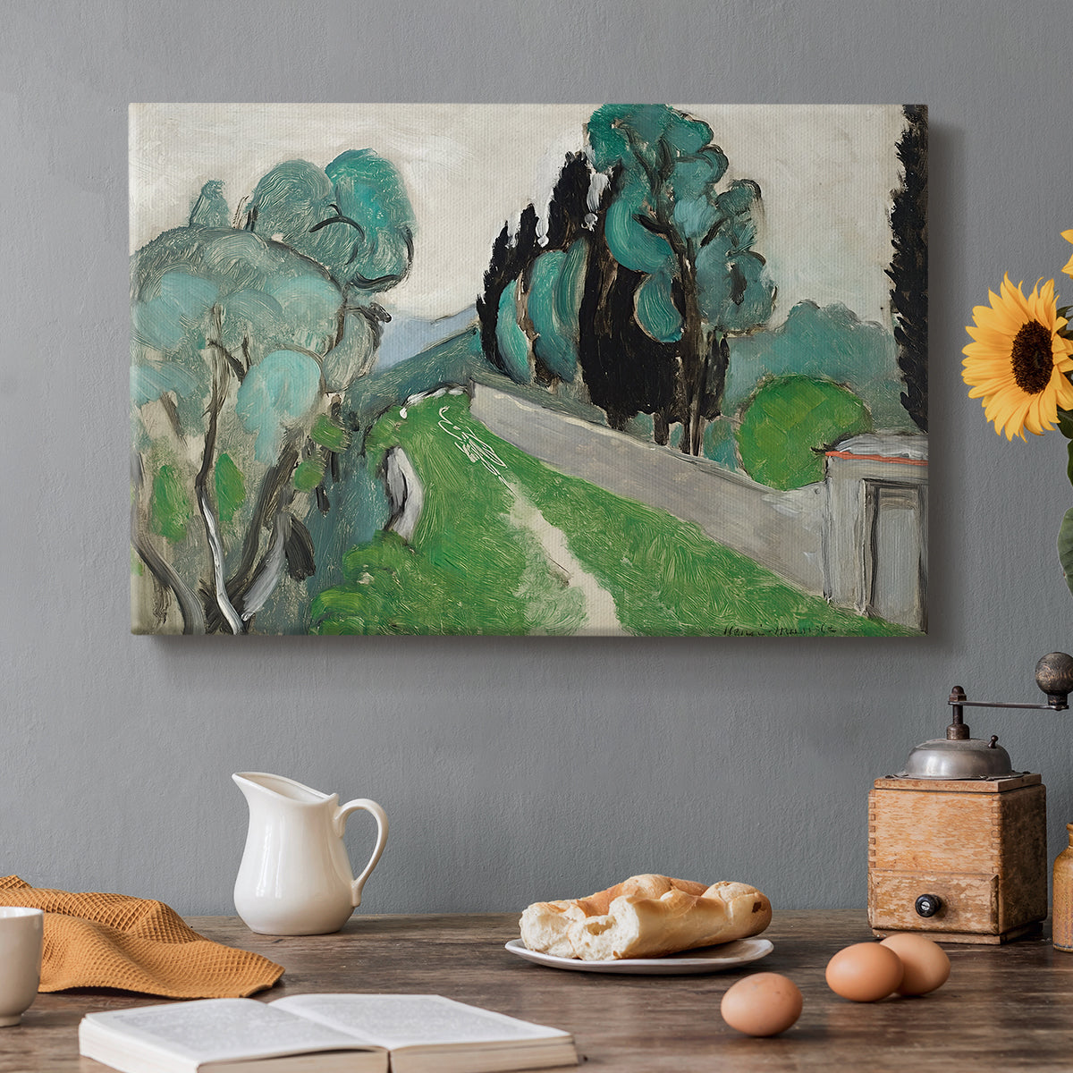 Canvas art print featuring a Mediterranean landscape with cypresses, olive trees, and rolling terrain, set in a cozy kitchen setting