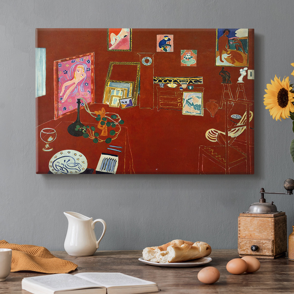 Canvas art print featuring a red studio interior with furniture and artworks, set in a cozy kitchen setting