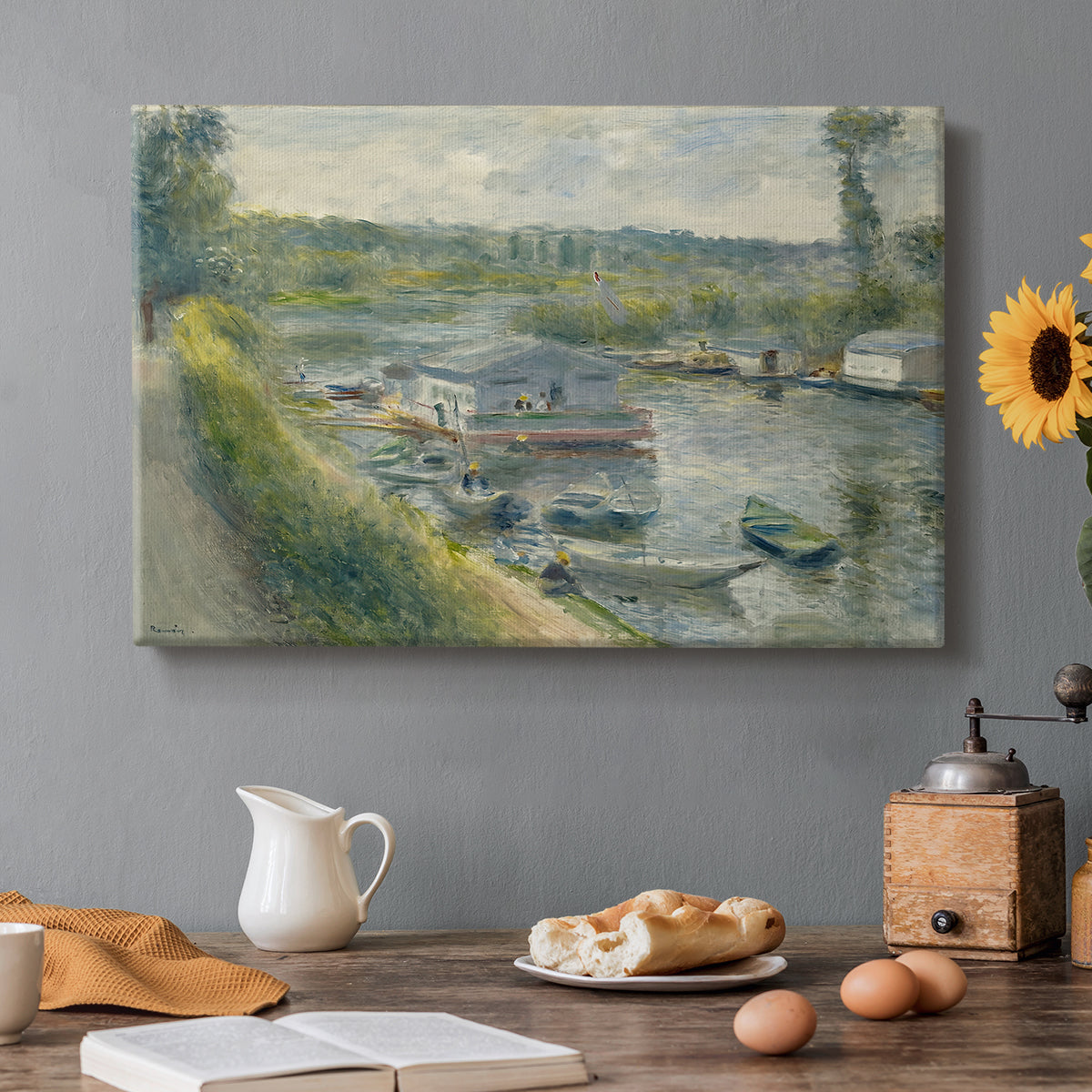 Canvas art print featuring a floating wash-house boat along a riverbank with figures working nearby, set in a cozy kitchen setting