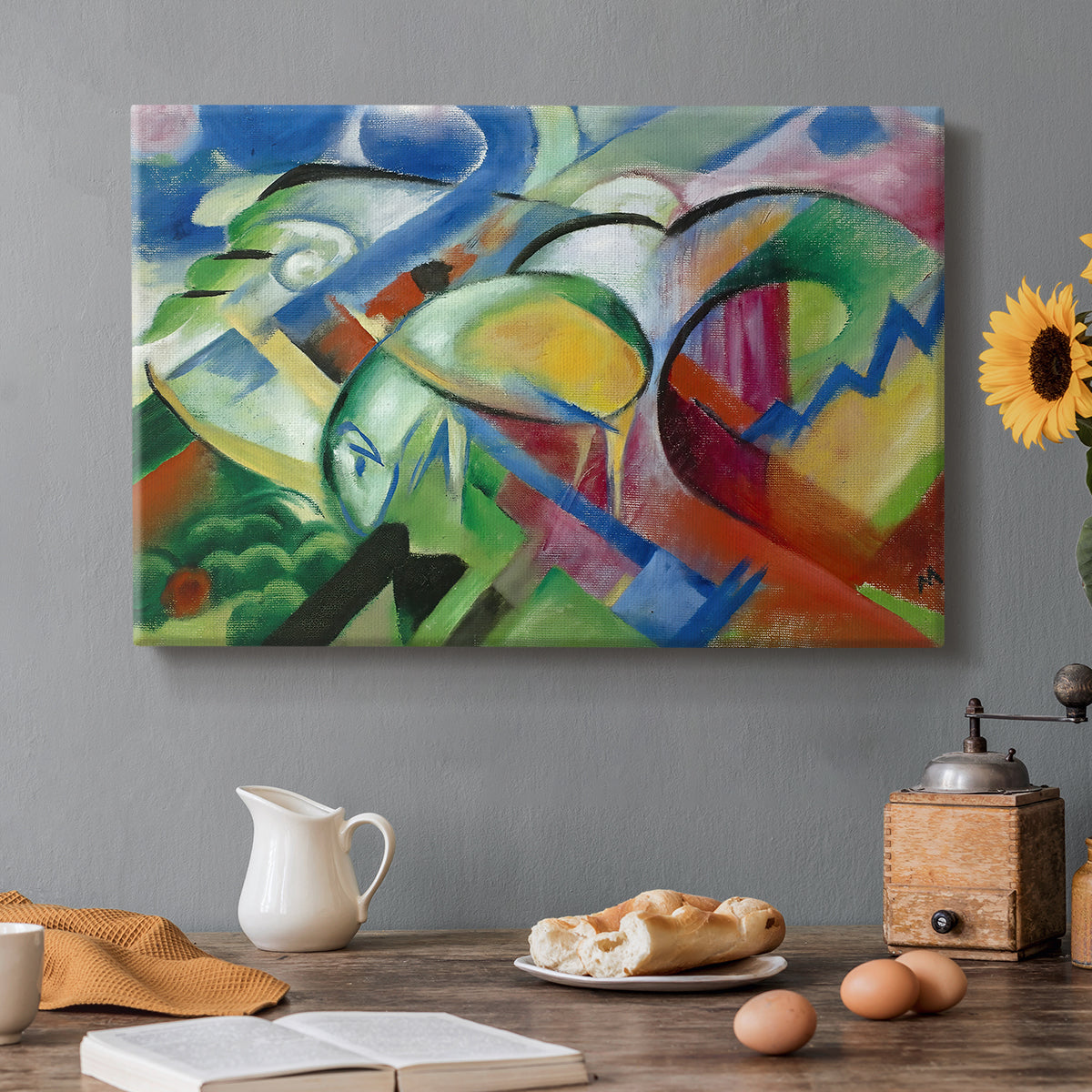 Canvas art print featuring abstracted sheep forms integrated into colorful geometric landscape, set in a cozy kitchen setting