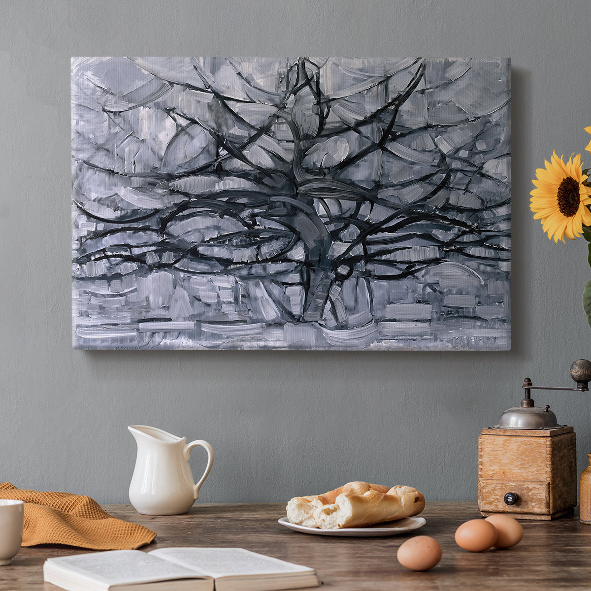 Canvas art print featuring a branching tree reduced to dark lines, set in a cozy kitchen setting