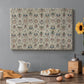 Canvas art print featuring a repeating floral pattern with symmetrical layout across elongated textile surface, set in a cozy kitchen setting