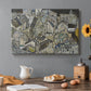 Canvas art print featuring clustered geometric houses forming dense urban landscape with sharp angles, set in a cozy kitchen setting