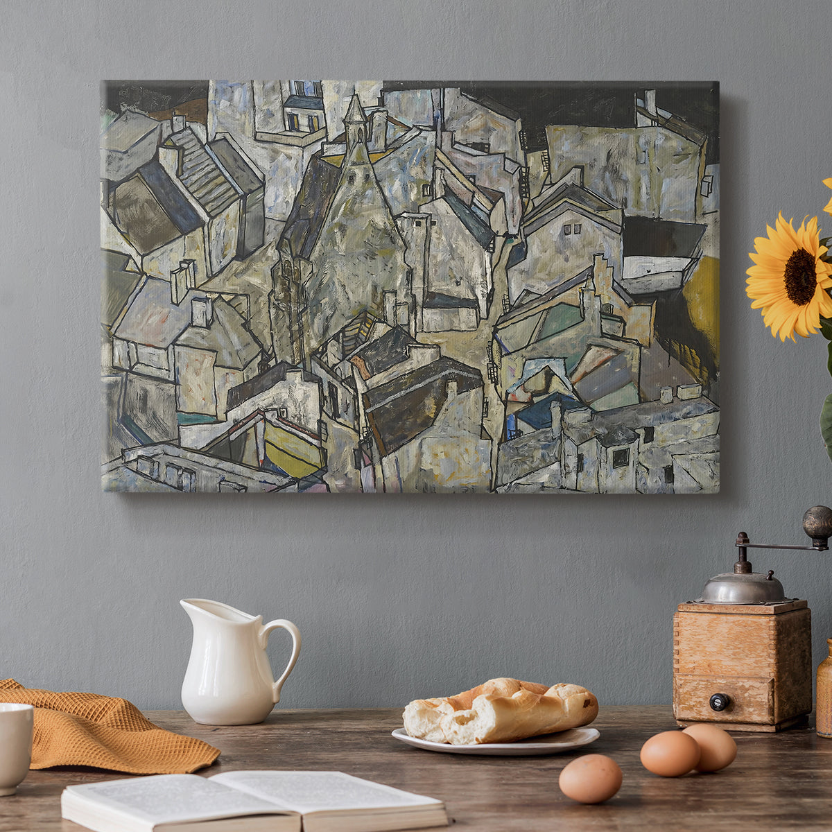 Canvas art print featuring clustered geometric houses forming dense urban landscape with sharp angles, set in a cozy kitchen setting