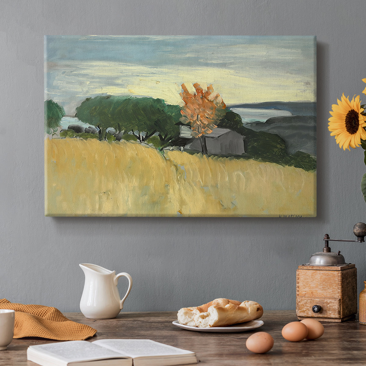Canvas art print featuring a golden wheat field stretching across a sunlit landscape under open sky, set in a cozy kitchen setting