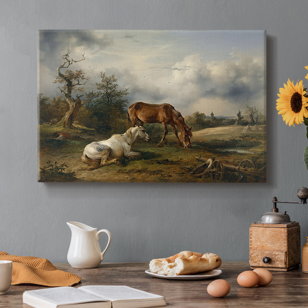 Canvas art print featuring two horses grazing in open pasture, set in a cozy kitchen setting