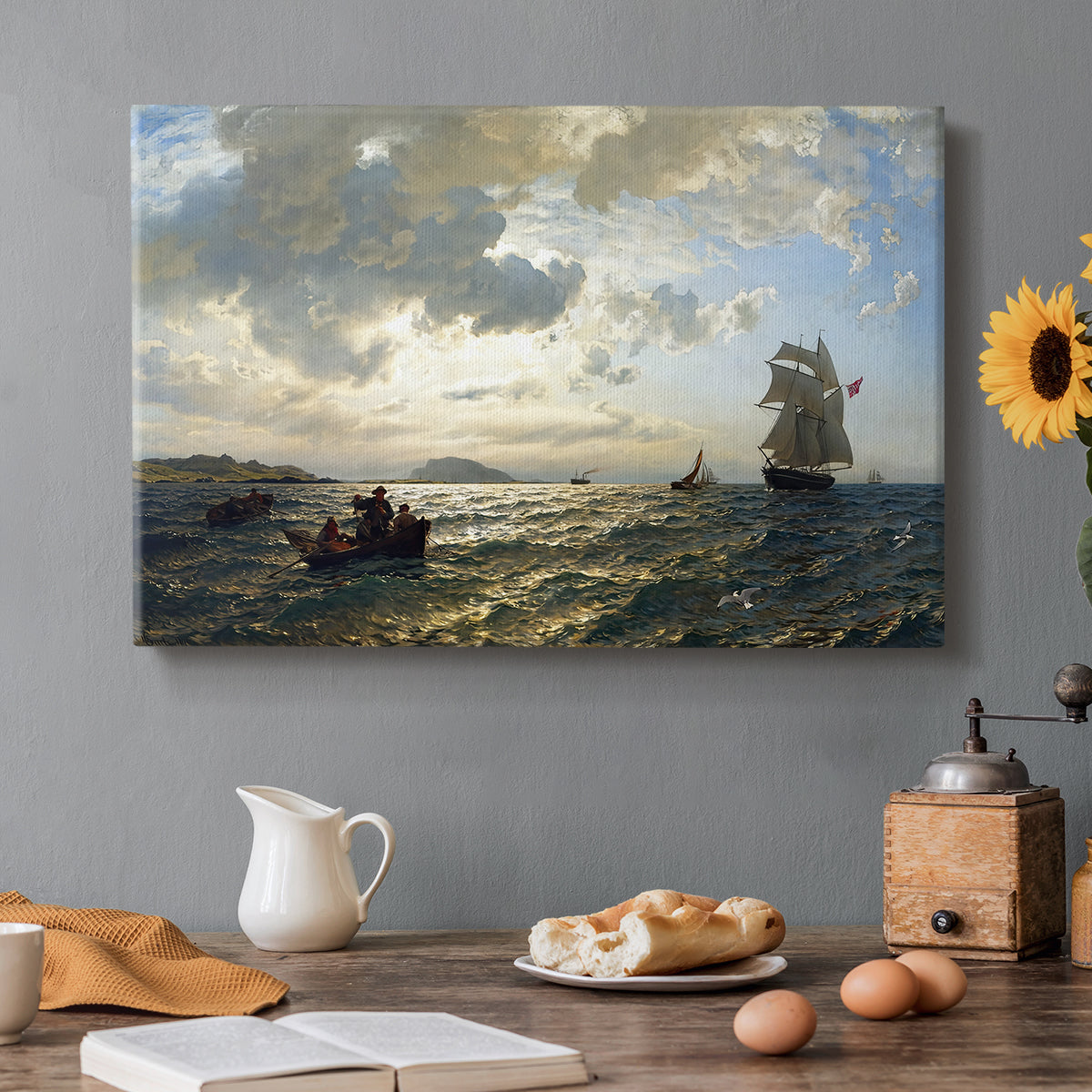 Canvas art print featuring a breezy coastal landscape with waves, boats, and open sky, set in a cozy kitchen setting