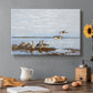 Canvas art print featuring a group of geese gathered near water in a natural wetland landscape, set in a cozy kitchen setting