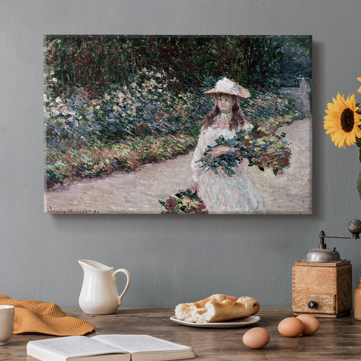 Canvas art print featuring a young girl seated in lush garden surrounded by blooming flowers, set in a cozy kitchen setting
