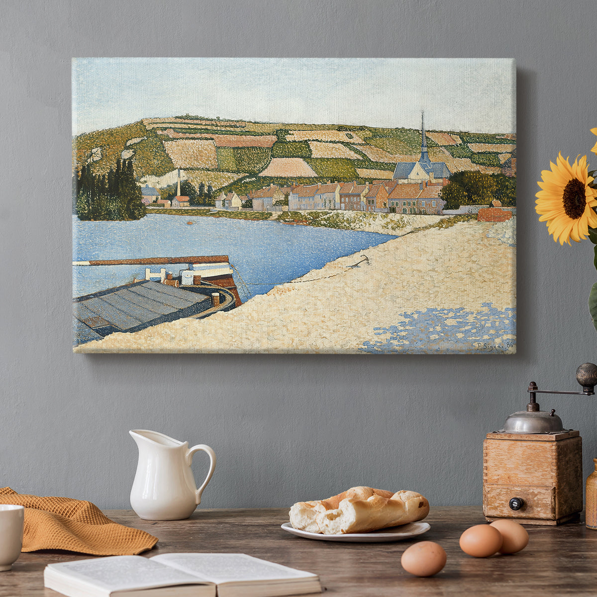 Canvas art print featuring a riverside with buildings and flowing water, set in a cozy kitchen setting
