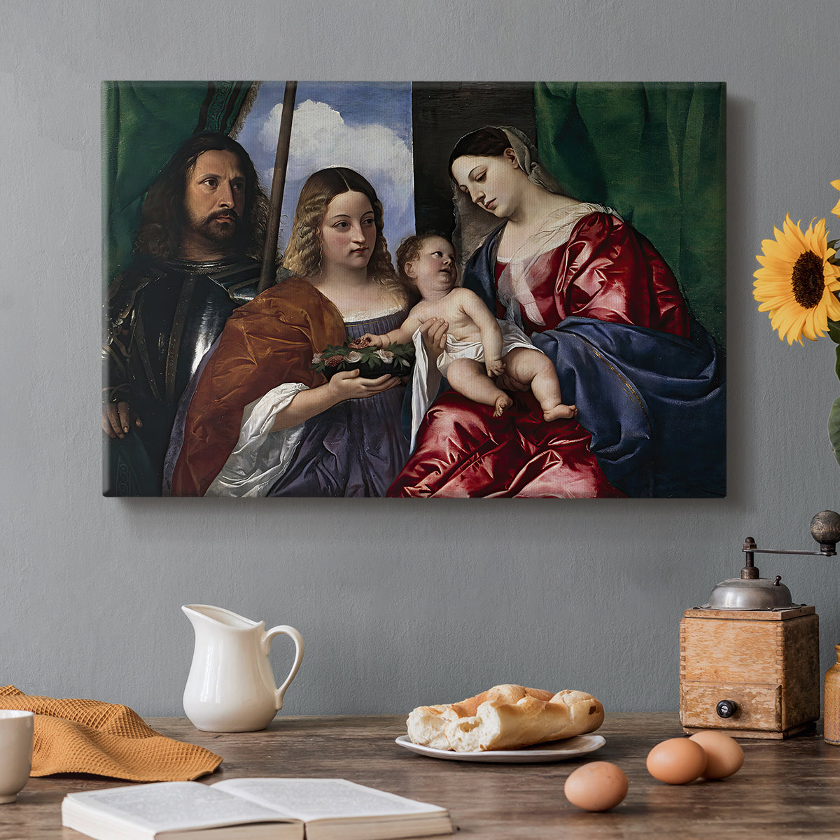 Canvas art print featuring a Madonna and child seated with two saints standing in dark interior setting, set in a cozy kitchen setting