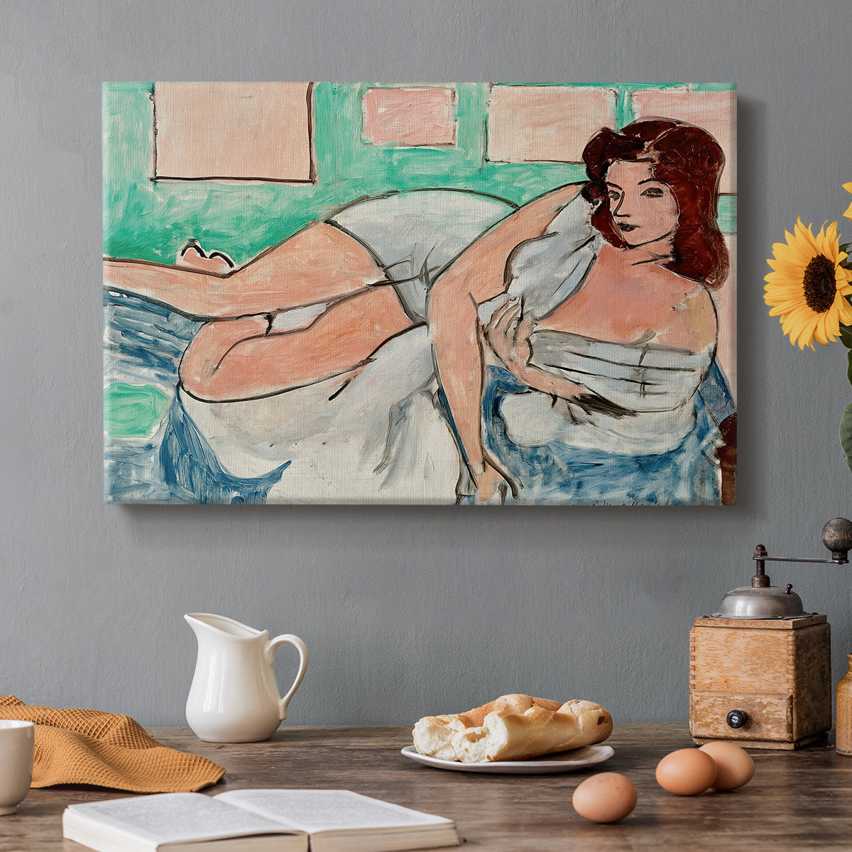 Canvas art print featuring a reclining nude wearing a bathrobe in a colorful interior, set in a cozy kitchen setting