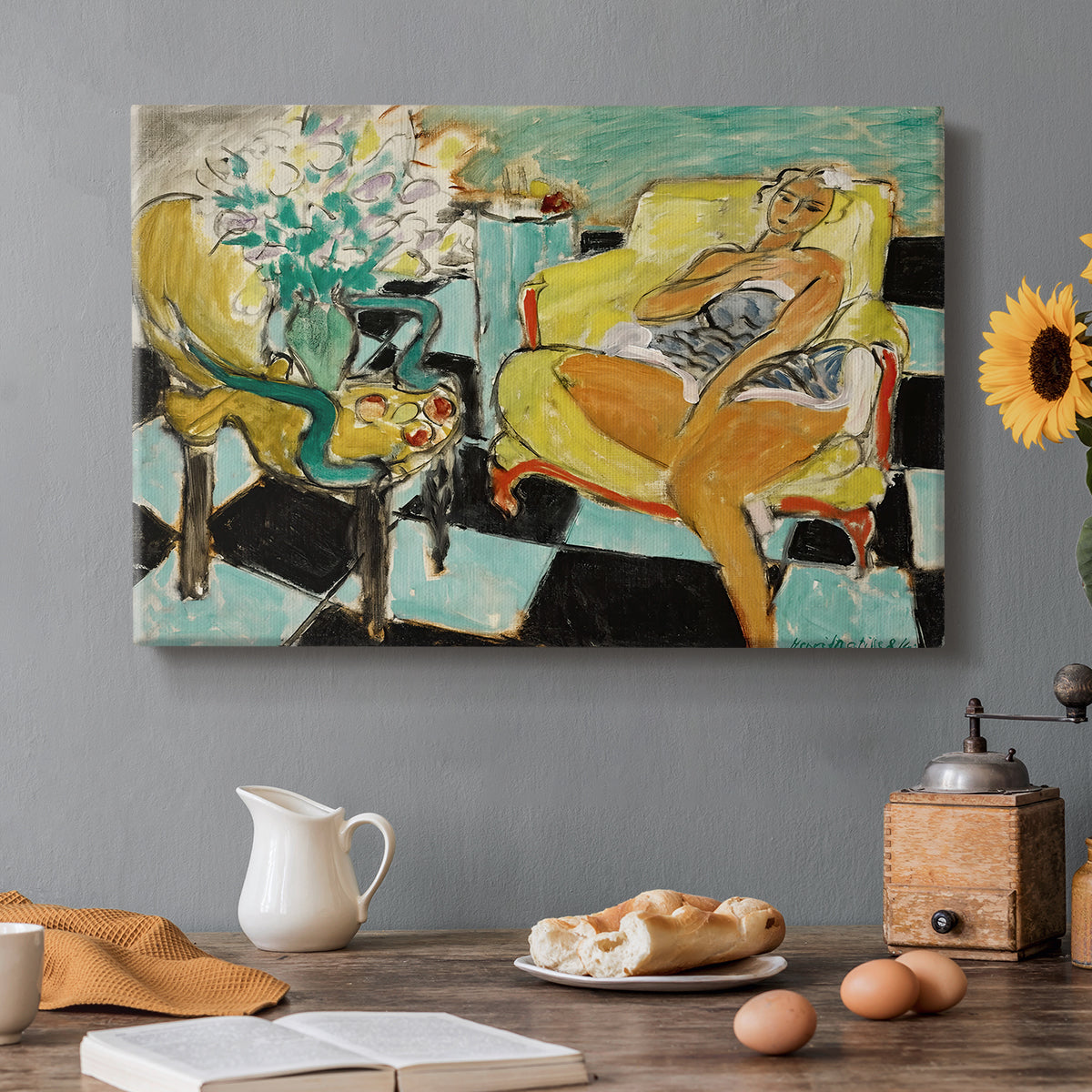 Canvas art print featuring a seated woman posed with a flower in a bright interior, set in a cozy kitchen setting