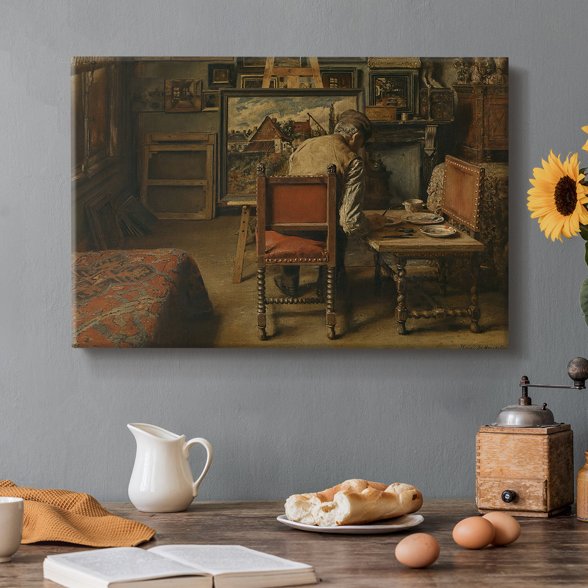 Canvas art print featuring a figure seated indoors carefully working on artwork at table, set in a cozy kitchen setting
