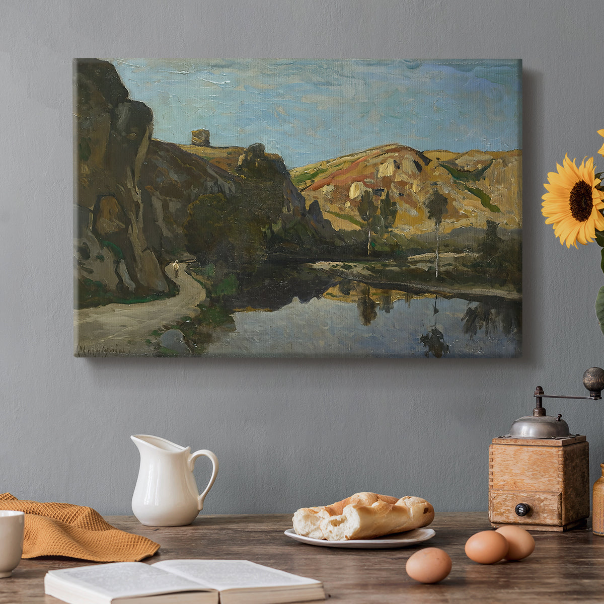 Canvas art print featuring a river flowing between rocky cliffs under open sky, set in a cozy kitchen setting