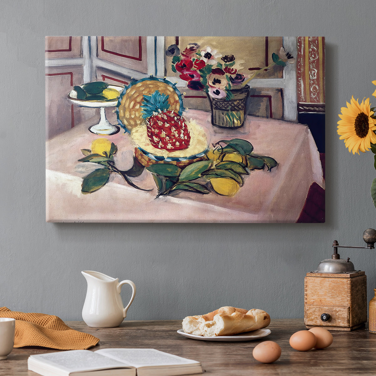 Canvas art print featuring a tabletop still life with pineapple, lemons, and fruit, set in a cozy kitchen setting