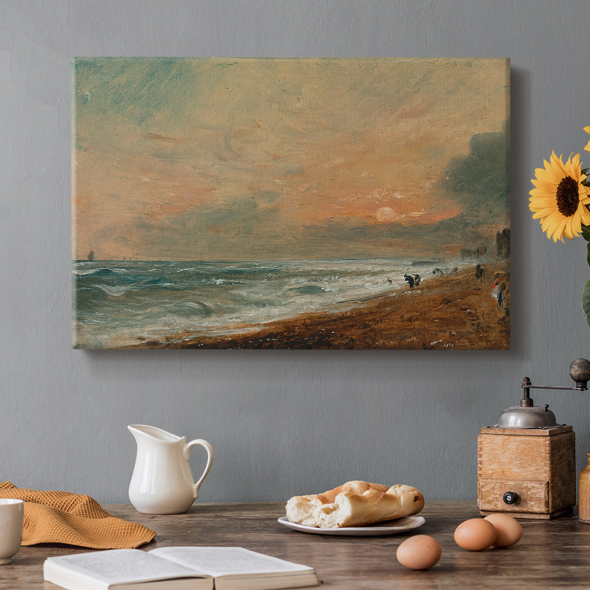 Canvas art print featuring a coastal shoreline with waves and open sky along beach, set in a cozy kitchen setting