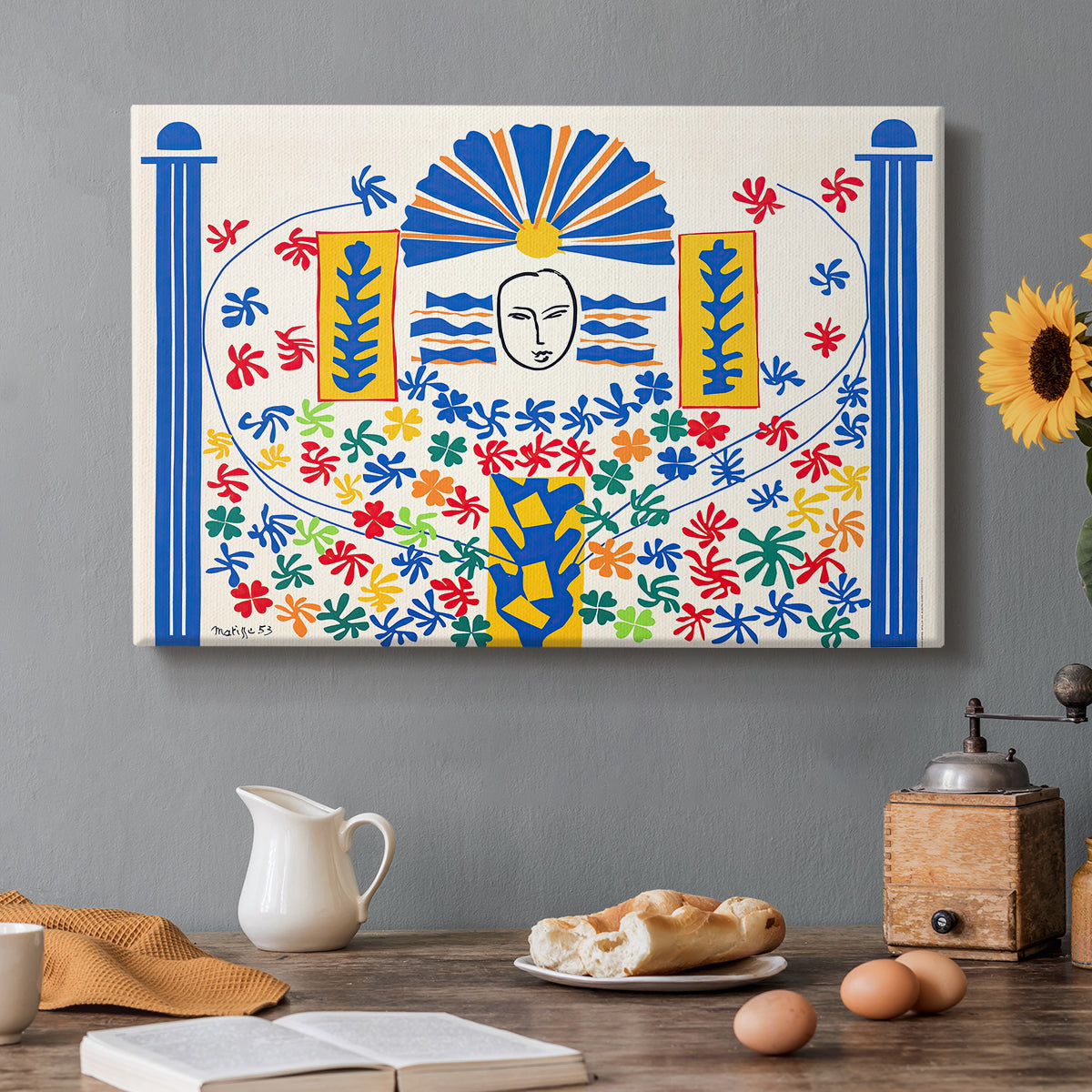 Canvas art print featuring an abstract geometric composition with stylized human and decorative elements, set in a cozy kitchen setting