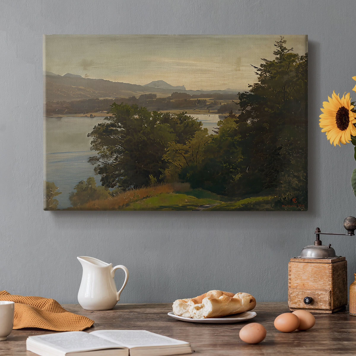 Canvas art print featuring a lake surrounded by hills with reflective water and open sky, set in a cozy kitchen setting