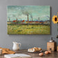 Canvas art print featuring industrial buildings with smokestacks rising above flat landscape, set in a cozy kitchen setting
