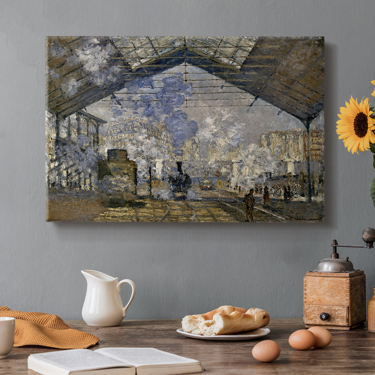 Canvas art print featuring a train station interior filled with steam and locomotives under iron structure, set in a cozy kitchen setting