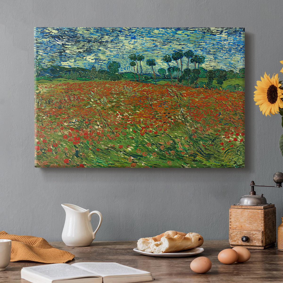 Canvas art print featuring a field dotted with red poppies stretching across green landscape, set in a cozy kitchen setting