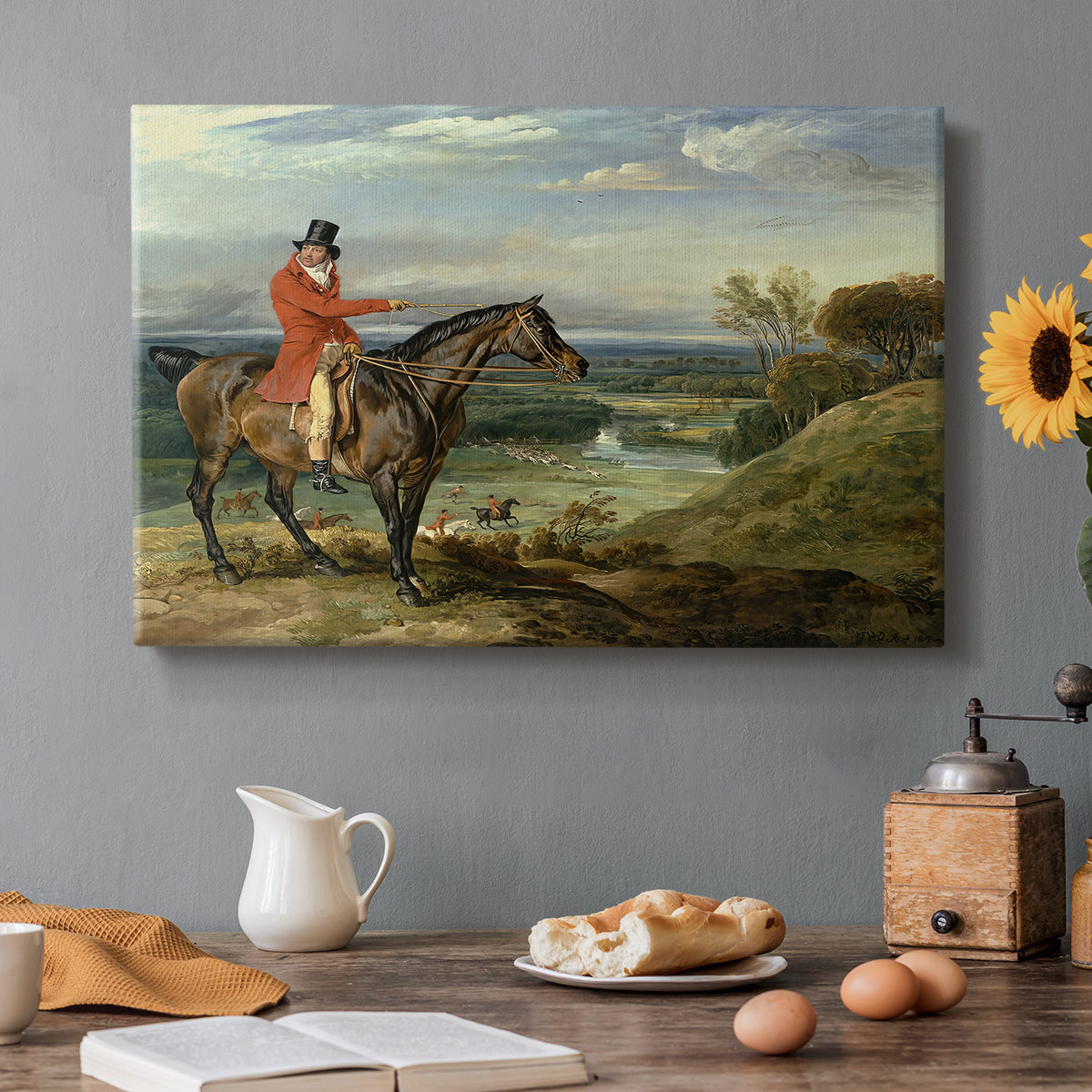 Canvas art print featuring a mounted hunter with dogs pursuing game across open landscape, set in a cozy kitchen setting