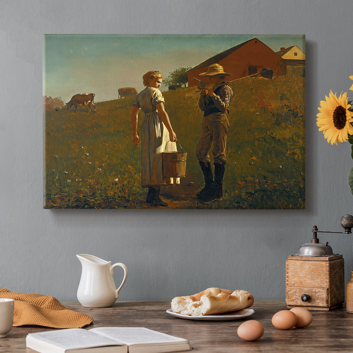 Canvas art print featuring two figures standing in open field near small building under wide sky, set in a cozy kitchen setting