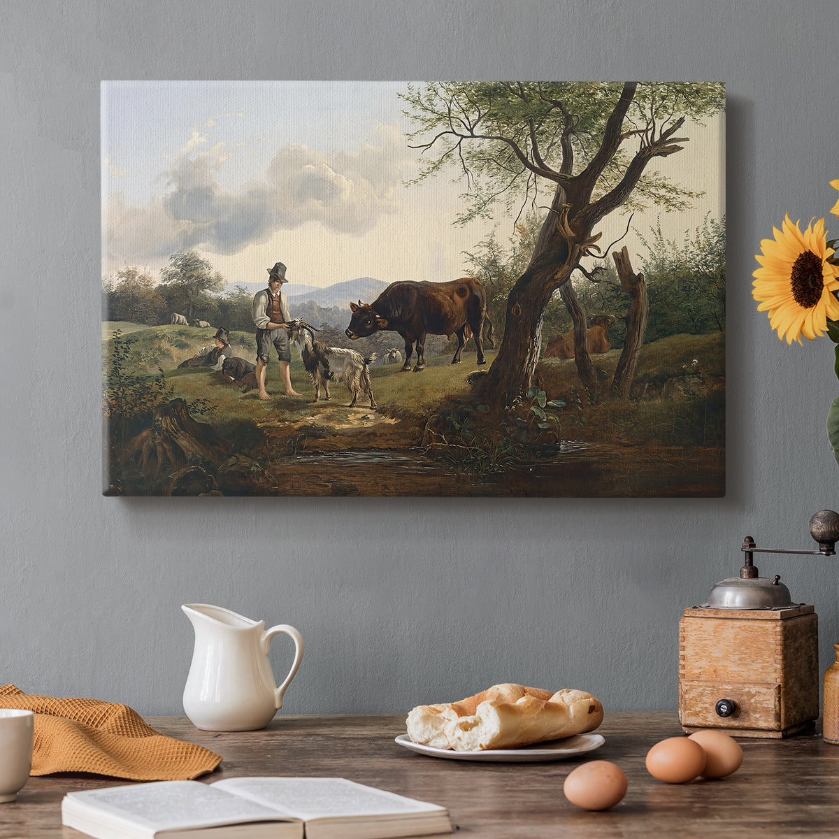 Canvas art print featuring a shepherd standing beside goat in countryside, set in a cozy kitchen setting