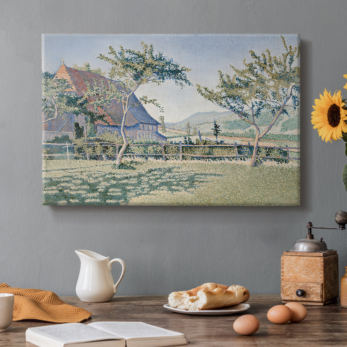 Canvas art print featuring a village with meadow and buildings in soft dotted color, set in a cozy kitchen setting